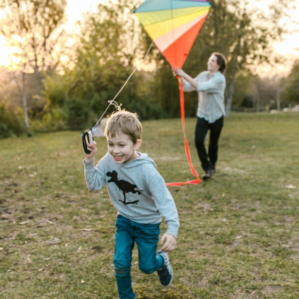 Boy running with kite