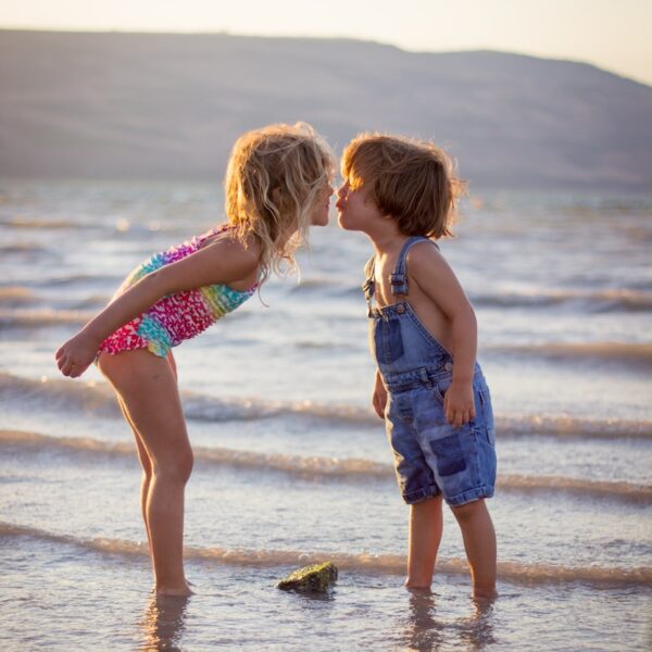 Kids kissing on beach